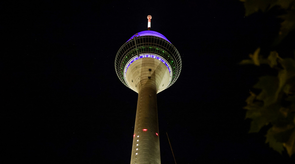 An observation tower illuminated at night