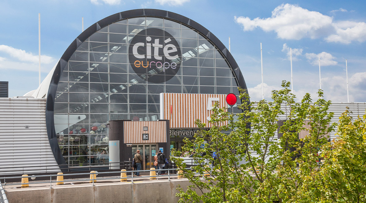 The round glass entrance to a large hypermarket called ‘Cité Europe