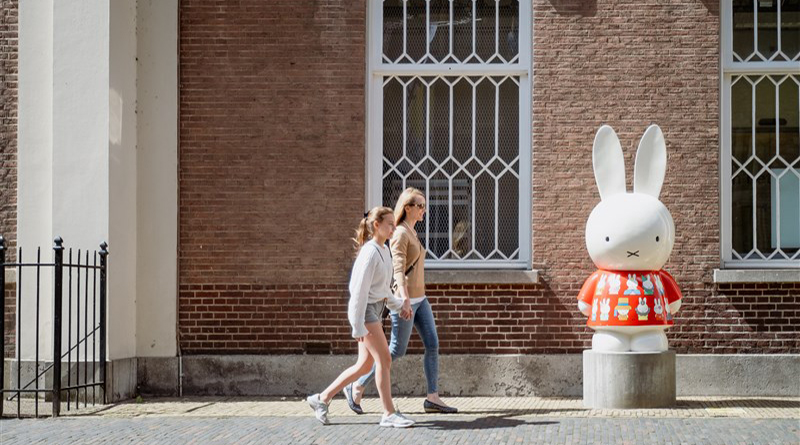 Visitors in Utrecht stroll past a statue of Miffy, the world-famous bunny from the children’s book series