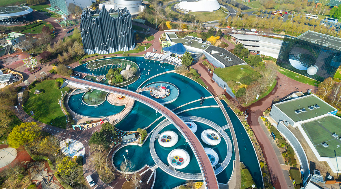 An overhead shot of part of a theme park, featuring water attractions
