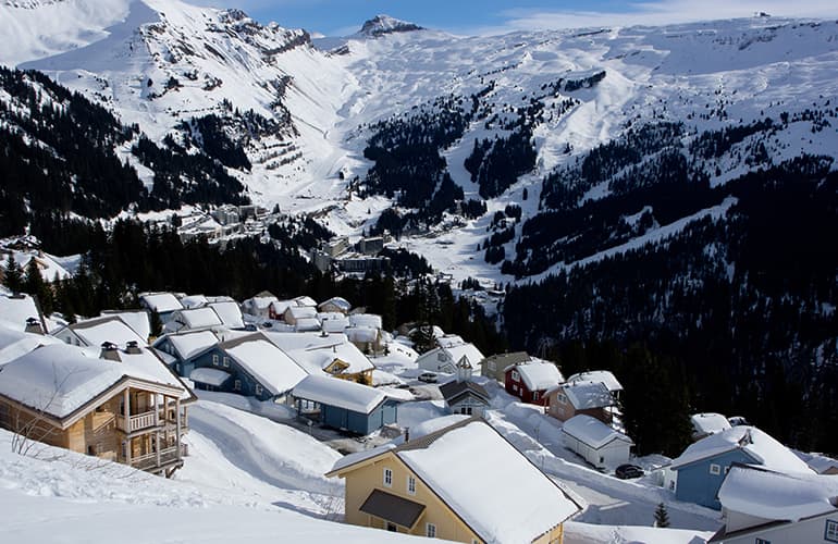 Snow covered mountainside and chalets in Flaine