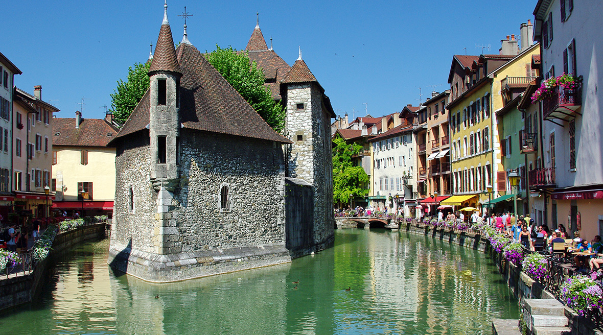 The Palais de l'Ile and canal on a summer’s morning